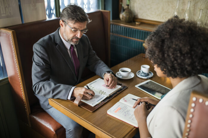 Business people discussing in the cafe