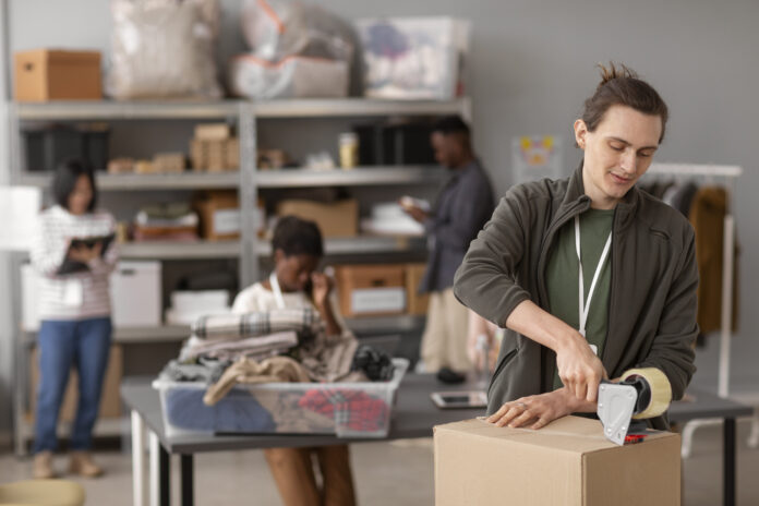 volunteer-helping-with-donation-box